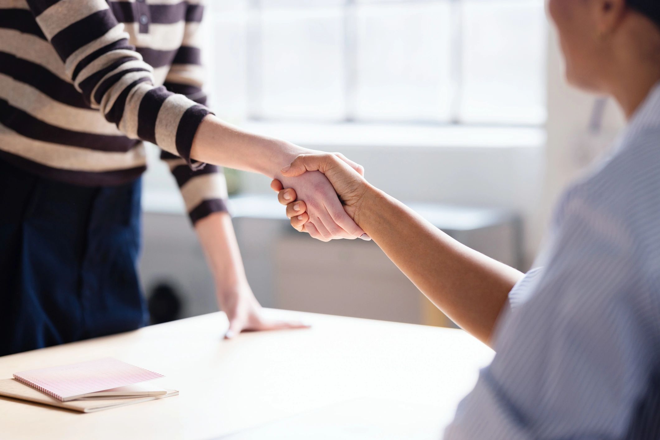 Customer trust represented by a professional handshake